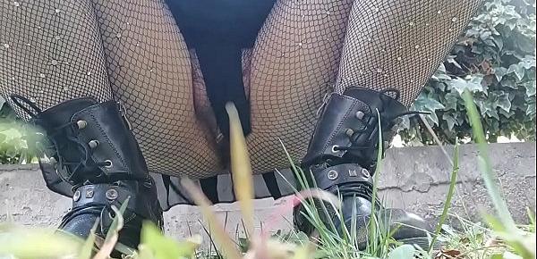  Your mother wants to piss in a public garden so she bends over and shows you her pussy under a pair of fishnet stockings